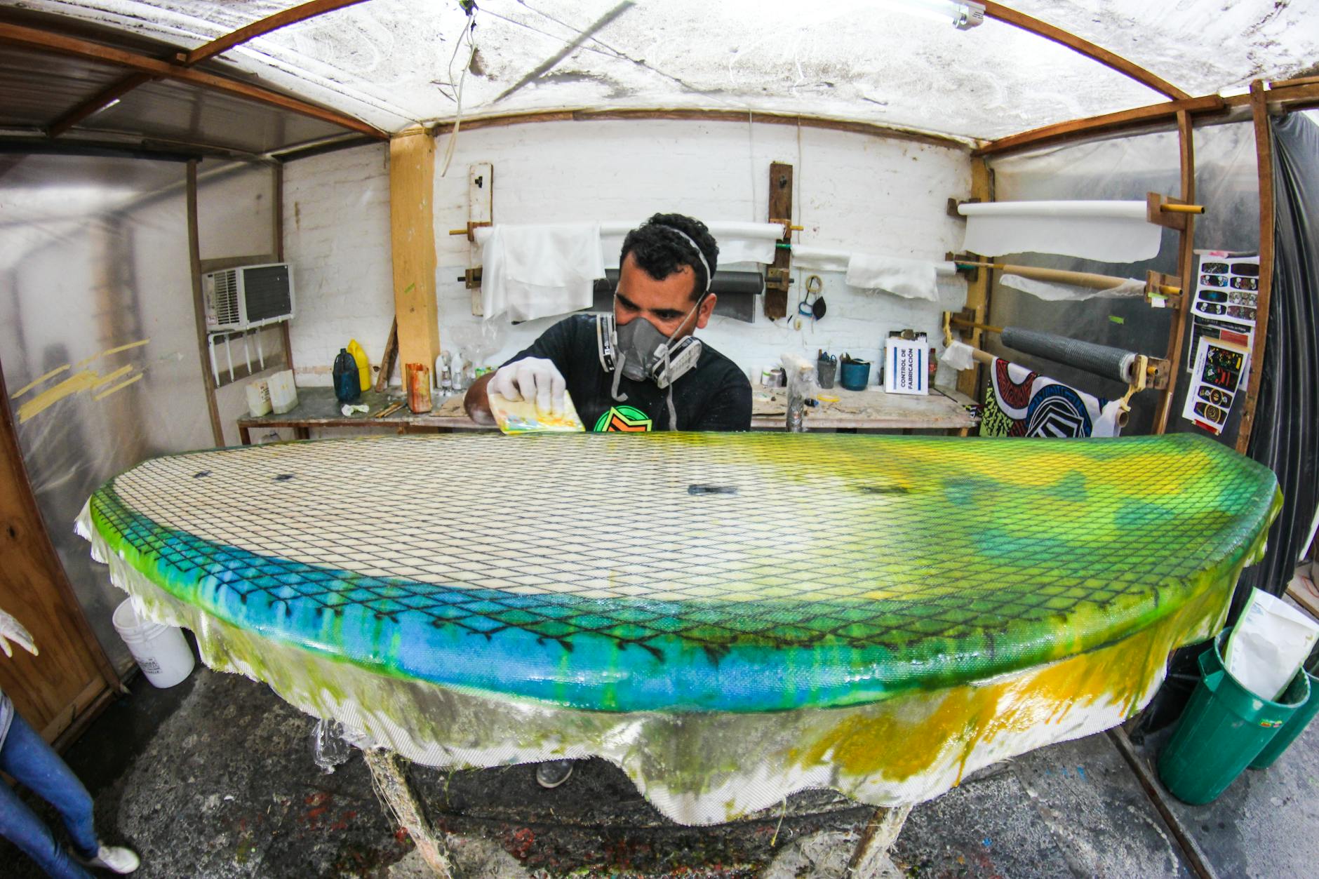 a man making a surfboard