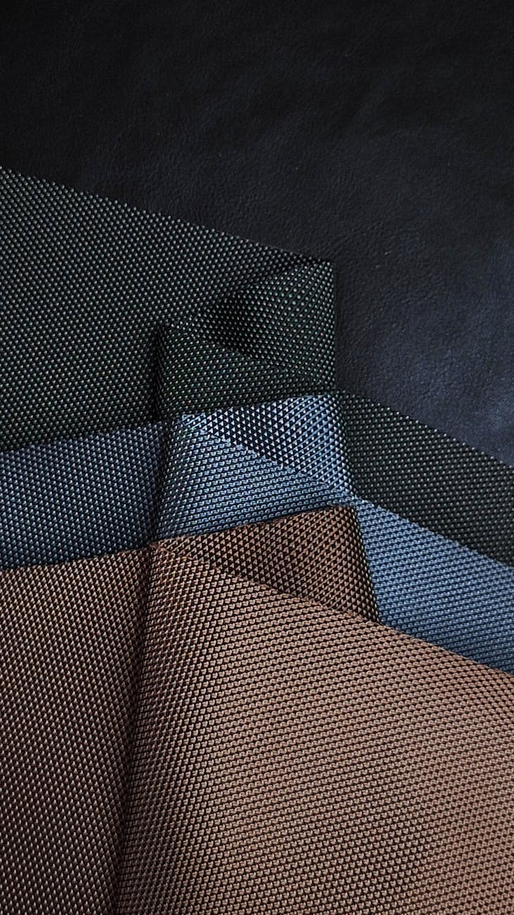 textured fabric swatches in dark tones